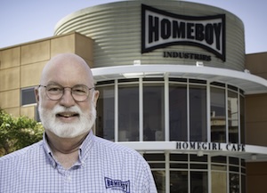 Father Boyle in front of Homeboy